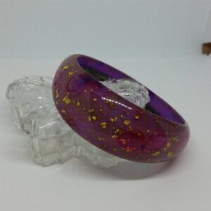 Lucite style purple bangle bracelet with glitter flakes and butterflies